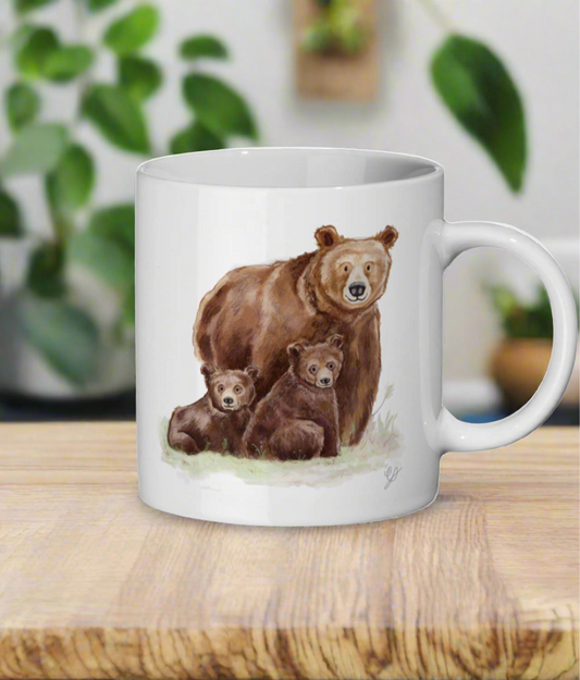 A white ceramic mug with a print of three watercolour bears