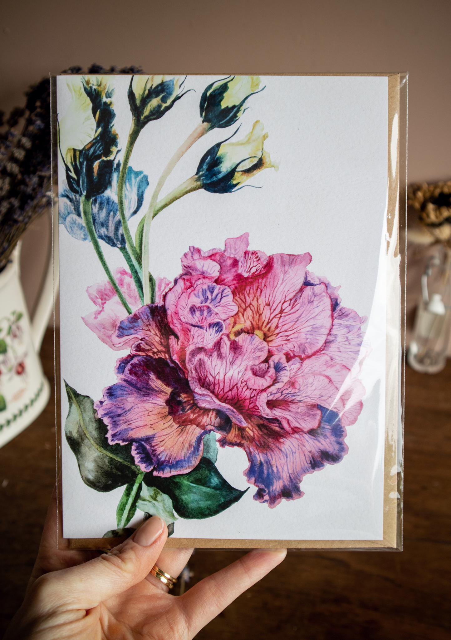 A photo of a Gentianaceae watercolour greetings card in its packaging