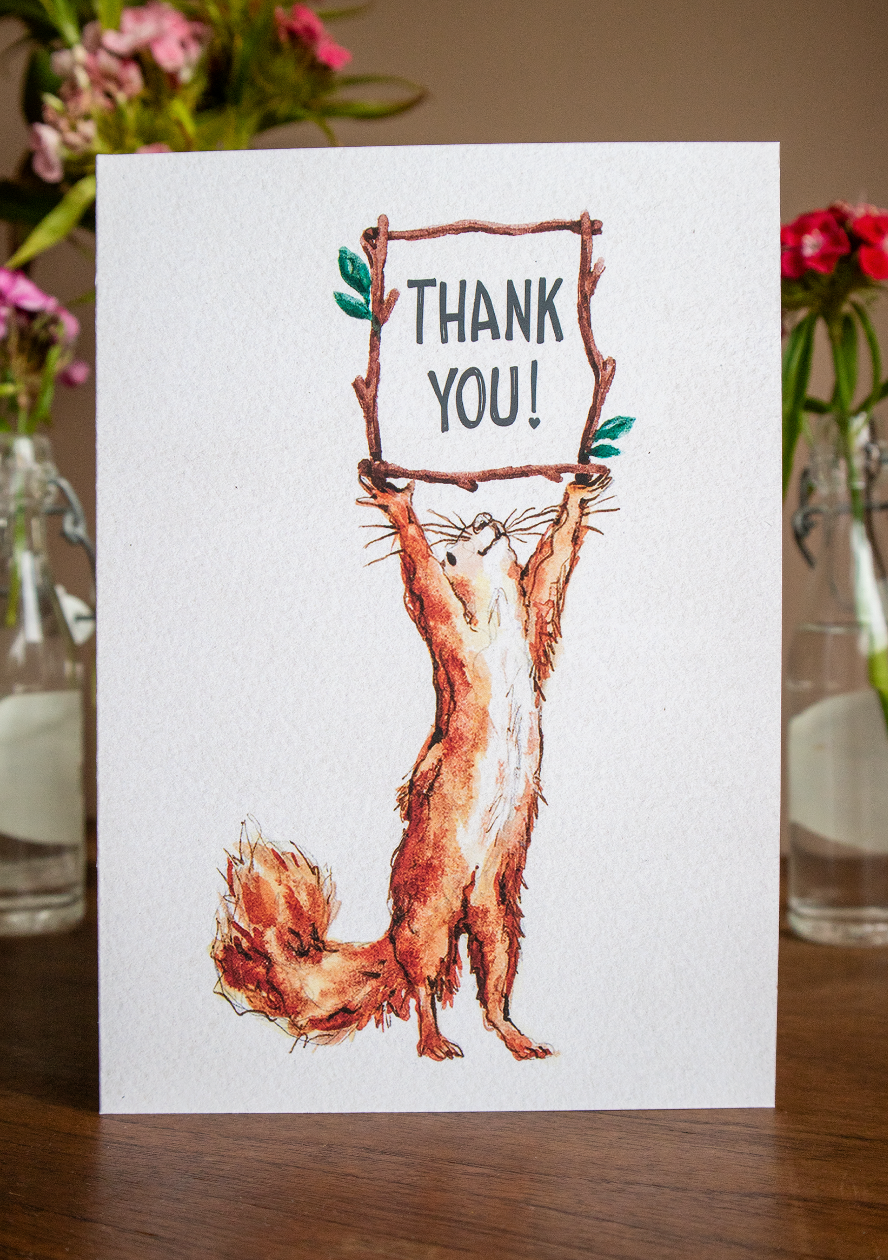 a photo of a thank you card with a squirrel watercolour on